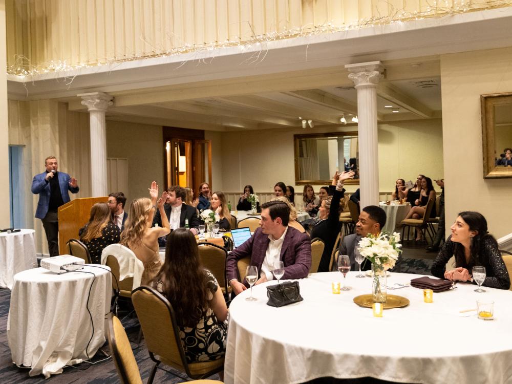 Attendees bid for items and experiences at the 2023 PILF Auction